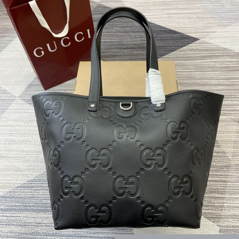 G*u*i shopping bags
